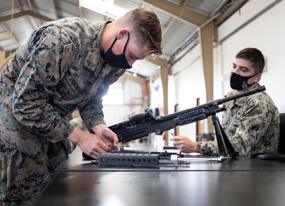 Marines receive Crew Served Weapons training from Maritime Expeditionary Security Group (MESG) 1 Training Evaluation Unit