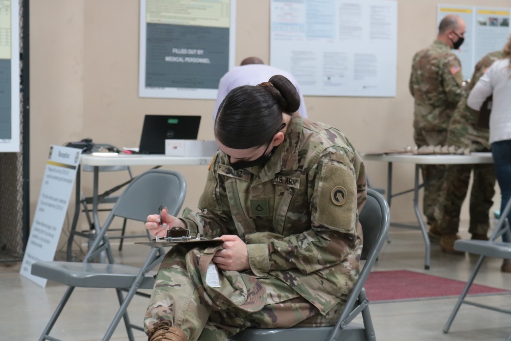 1st Theater Sustainment Command Soldier's receive the Covid-19 vaccine