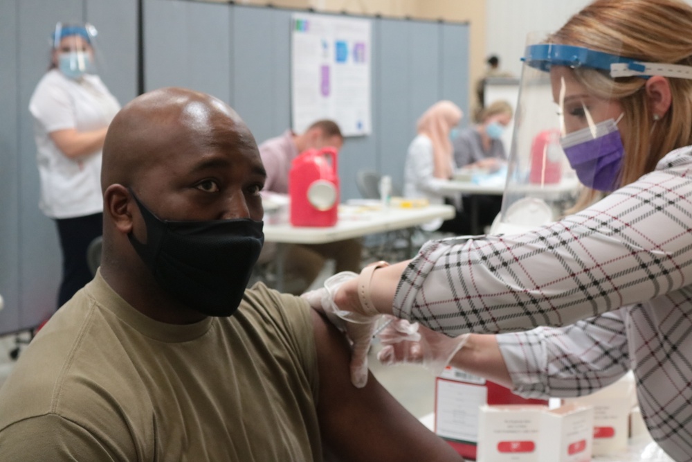 1st Theater Sustainment Command Soldier's receive the Covid-19 vaccine
