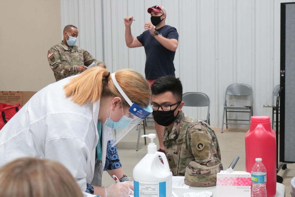 1st Theater Sustainment Command Soldier's receive the Covid-19 vaccine