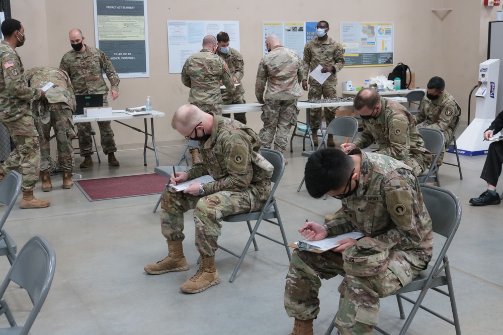 1st Theater Sustainment Command Soldier's receive the Covid-19 vaccine