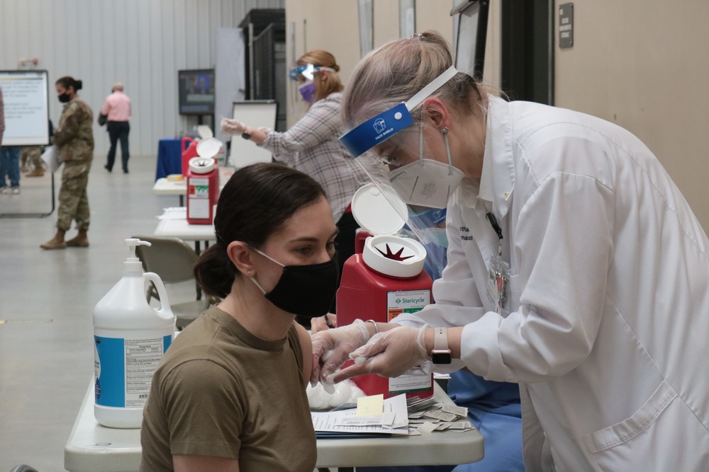 1st Theater Sustainment Command Soldier's receive the Covid-19 vaccine
