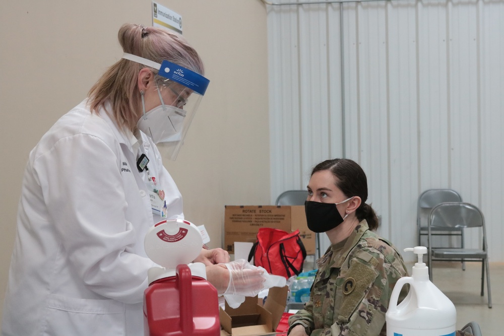 1st Theater Sustainment Command Soldier's receive the Covid-19 vaccine