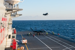Flight deck personnel refuel an F-35B aboard the Italian Navy flagship ITS Cavour