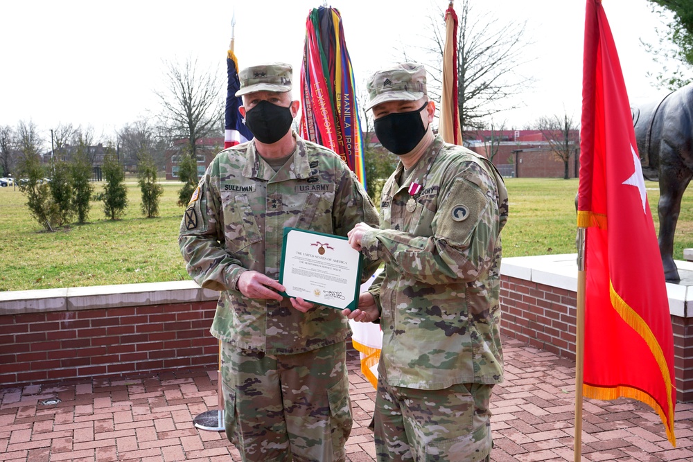 Sgt. Anthony Escobedo receives the meritorious service medal