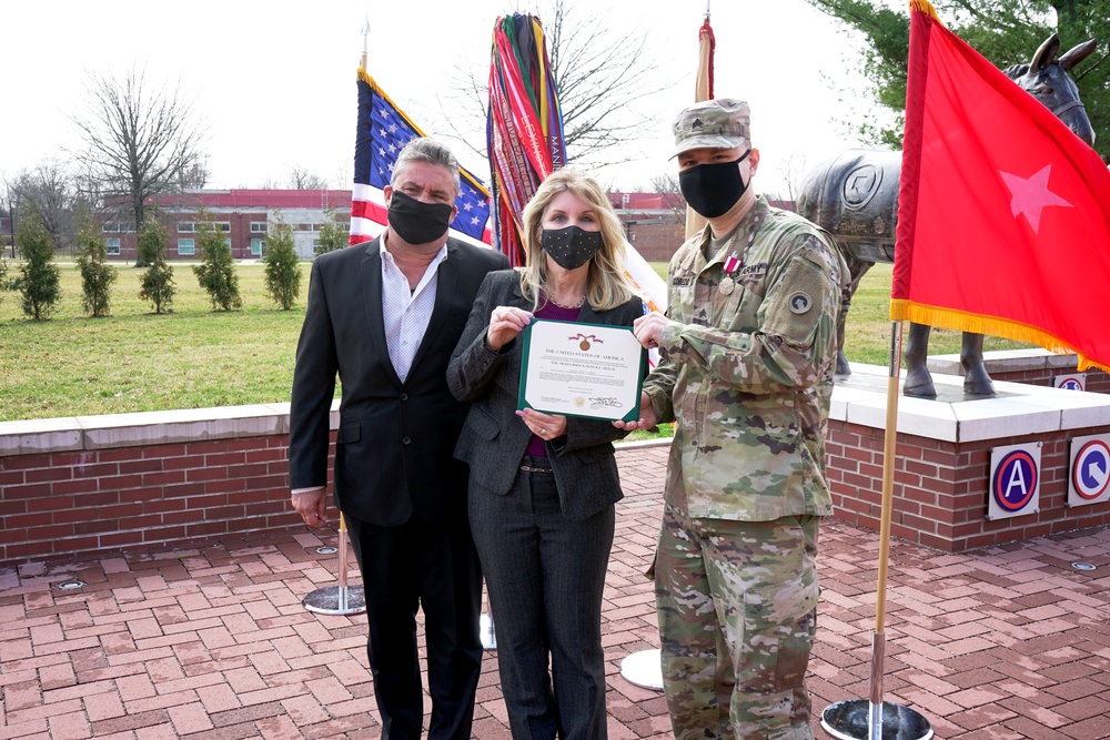 Sgt. Anthony Escobedo receives the meritorious service medal