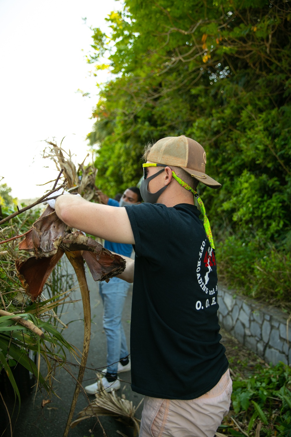Marines with 9th Engineer Support Battalion trade in rifles for rakes for garden clean up