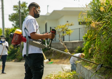 Marines with 9th Engineer Support Battalion trade in rifles for rakes for garden clean up