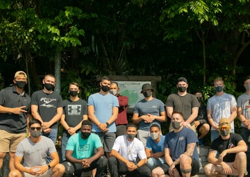 Marines with 9th Engineer Support Battalion trade in rifles for rakes for garden clean up