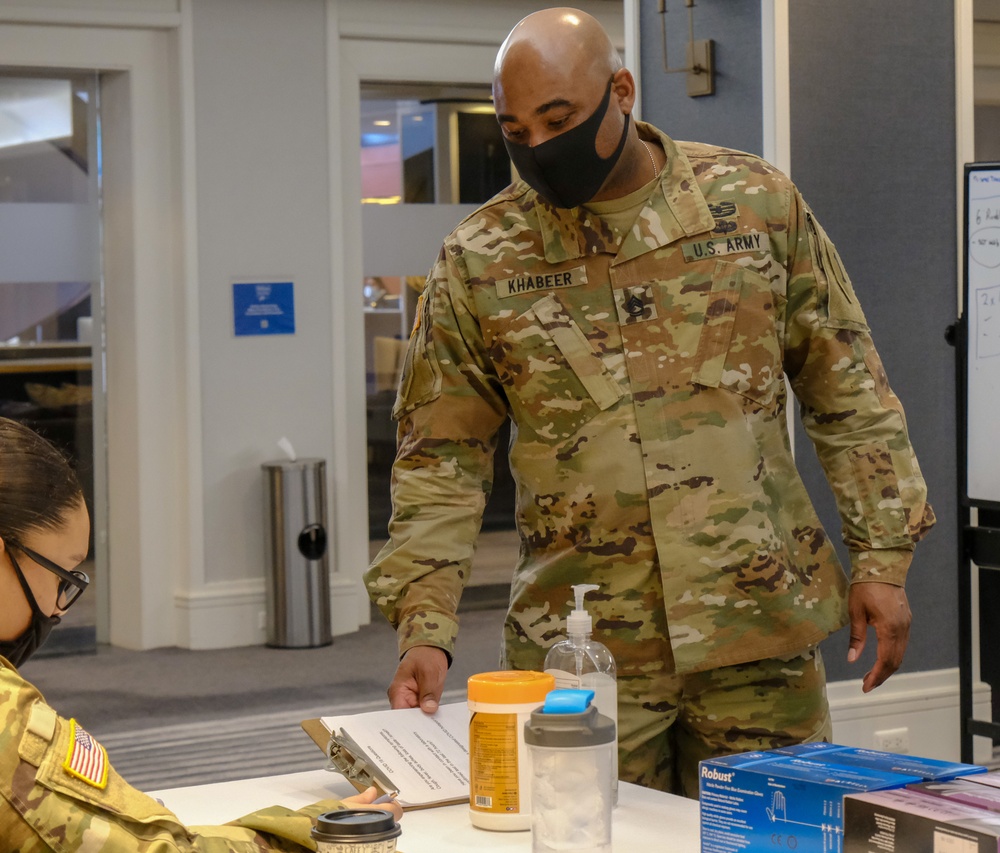 Service members in-process for new COVID Community Vaccination Centers