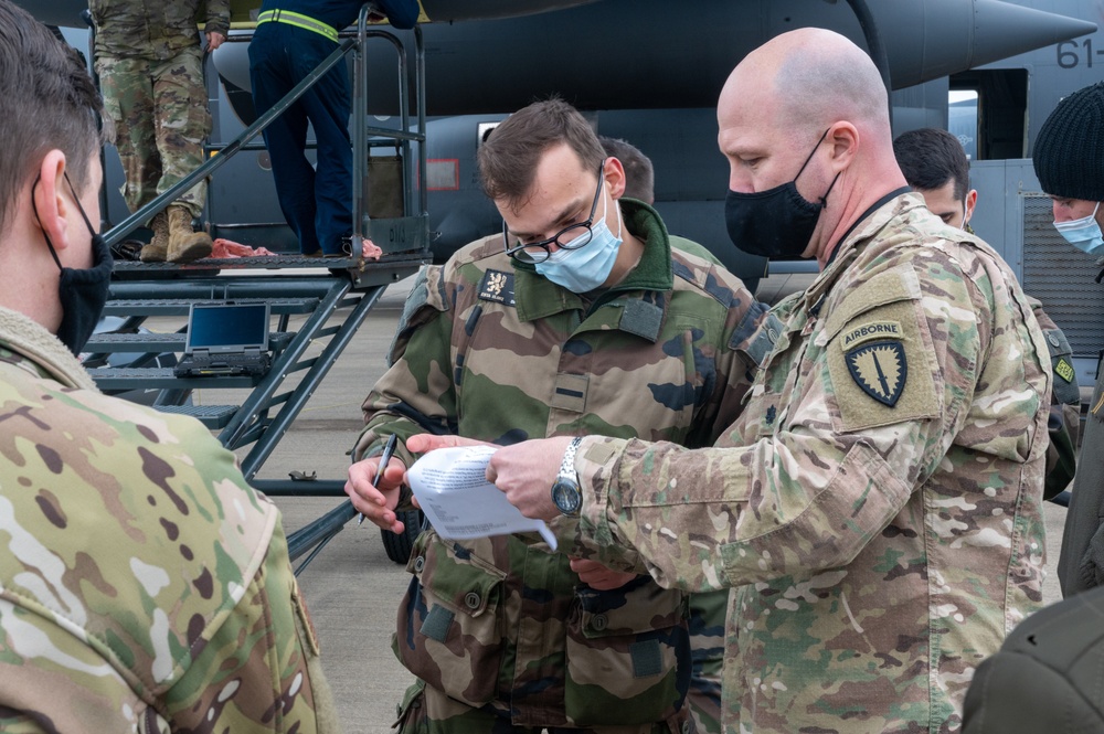 352d Special Operations Wing assist in repairing air-to-air refueling equipment on an Armée de l'Air et de l’Espace (French Air and Space Force) KC-130J