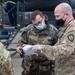 352d Special Operations Wing assist in repairing air-to-air refueling equipment on an Armée de l'Air et de l’Espace (French Air and Space Force) KC-130J