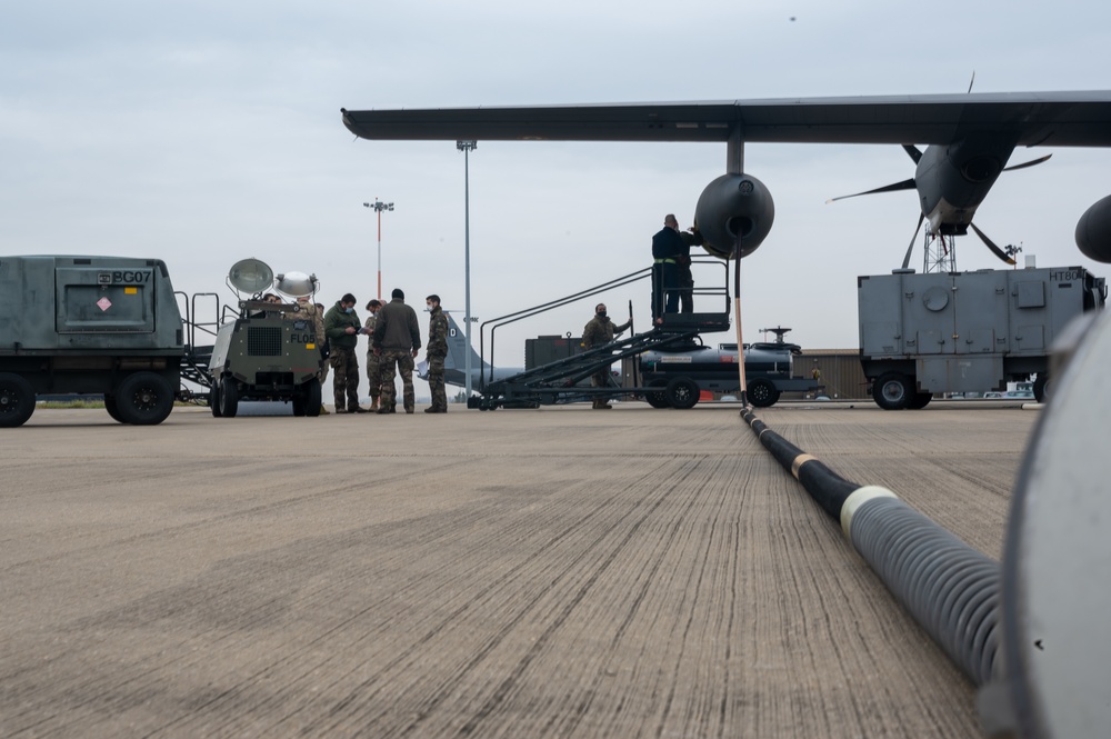 352d Special Operations Wing assist in repairing air-to-air refueling equipment on an Armée de l'Air et de l’Espace (French Air and Space Force) KC-130J