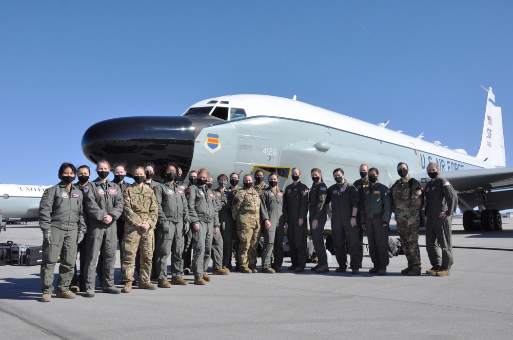 All female flight air crew and support staff group photo in front of RC-135 Rivet Joint