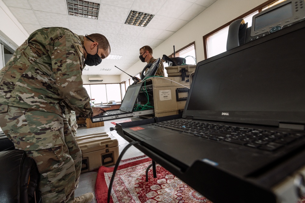 AUAB Airmen employ communication flyaway kits at Doha Air Base, Qatar