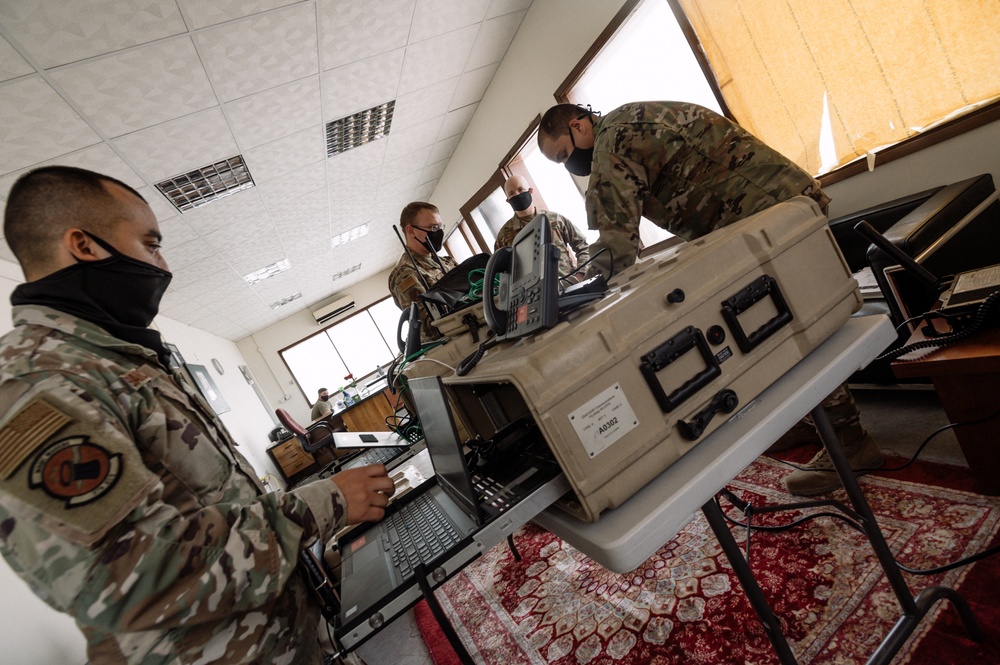 AUAB Airmen employ communication flyaway kits at Doha Air Base, Qatar