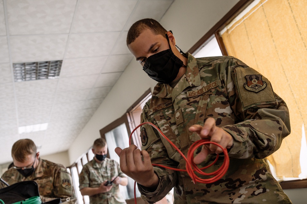 AUAB Airmen employ communication flyaway kits at Doha Air Base, Qatar