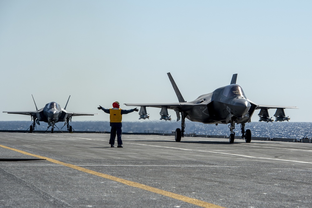 Italian Navy aircraft marshaller directs F-35B aboard ITS Cavour