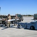 South Dakota Air Guardsmen load munitions on F-16s