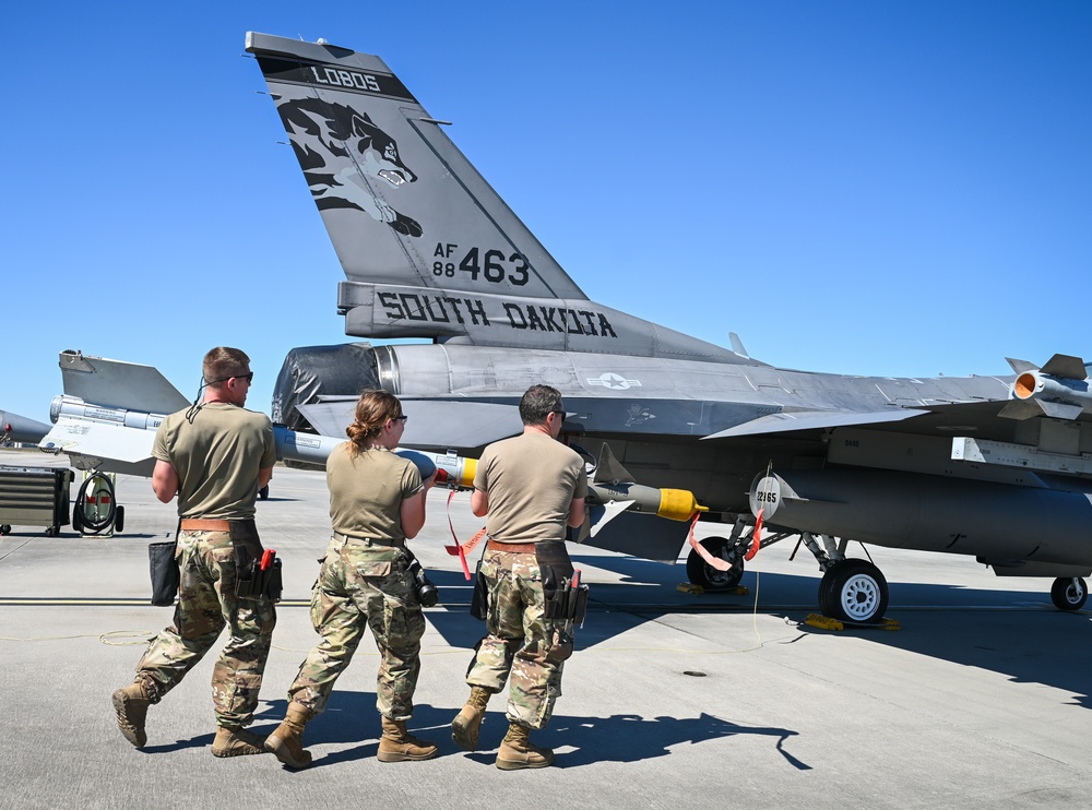 South Dakota Air Guardsmen load munitions on F-16s