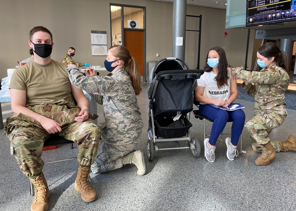 Nebraska National Guard family members receive doses of a COVID-19 vaccine