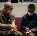 U.S. Marines, Okinawa residents participate in an English discussion class at MCAS Futenma