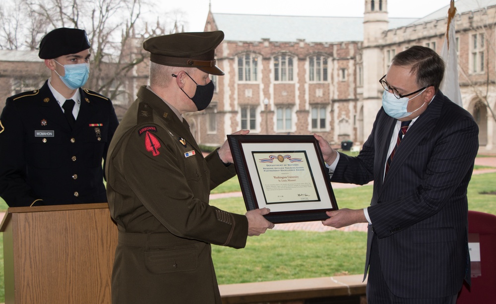 Maj. Gen. John R. Evans Jr. presents Chancellor Andrew D. Martin of Washington University in St. Louis the Department of Defense ROTC and Higher Educational Institution Partnership Excellence Award