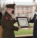 Maj. Gen. John R. Evans Jr. presents Chancellor Andrew D. Martin of Washington University in St. Louis the Department of Defense ROTC and Higher Educational Institution Partnership Excellence Award
