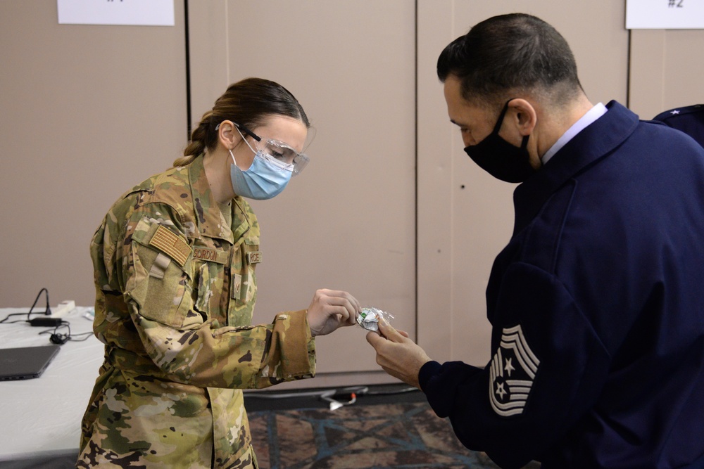 NJ State Command Chief Master Sgt. Michael Rakauckas visits with NJ Airmen supporting the COVID-19 Atlantic County Vaccination Mega-Site in Atlantic City, N.J.