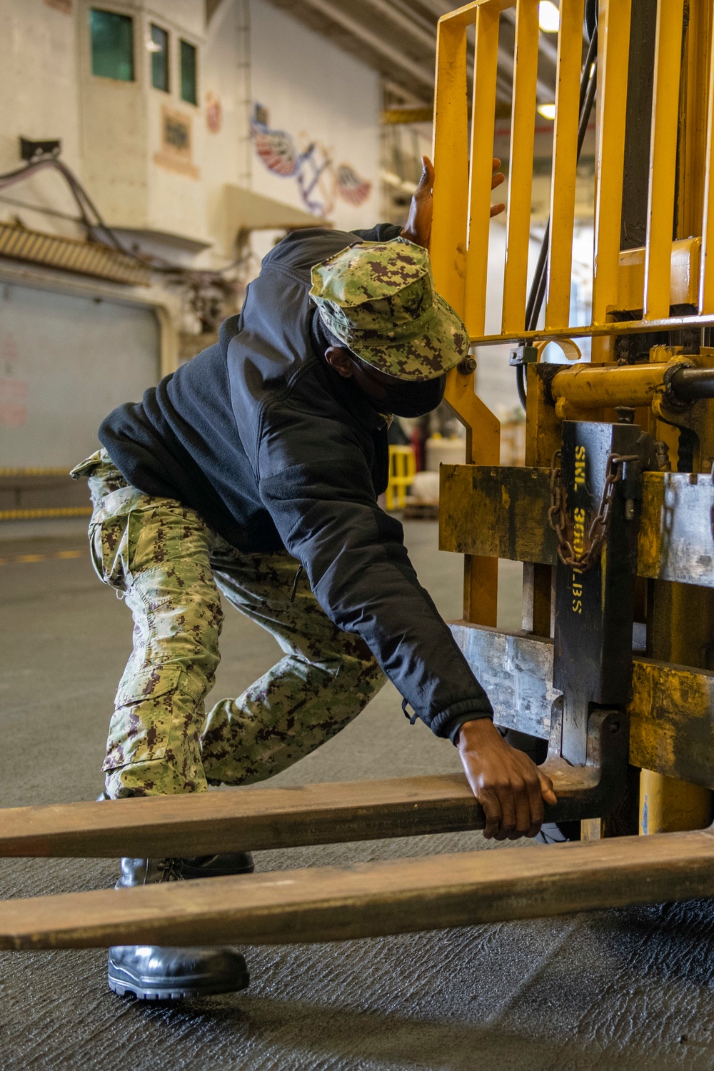 Sailor prepares a forklift