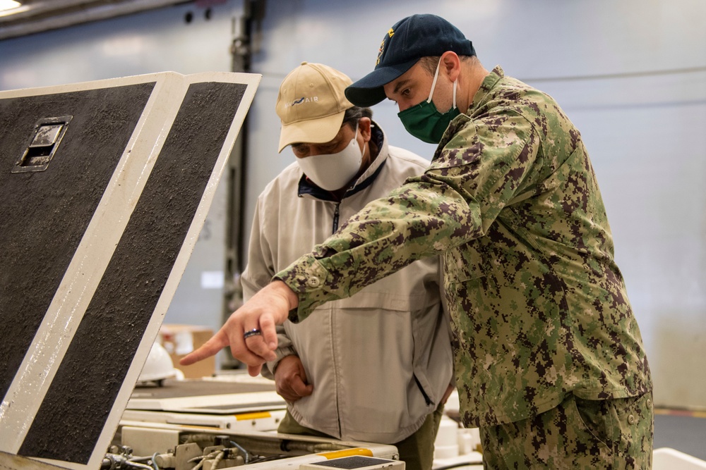 Sailor conducts maintenance