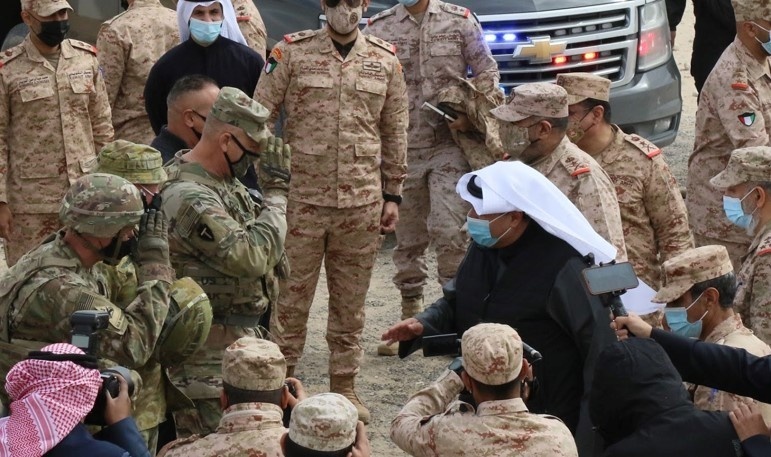 Task Force Spartan Commander, Major General Patrick Hamilton, greets Kuwait Minister of Defense Hamad Jaber Al-Ali Al-Sabah during his arrival to the joint exercise Al-Tahrir.