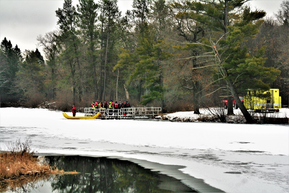 Fort McCoy firefighters practice surface ice rescue training at post's Swamp Pond