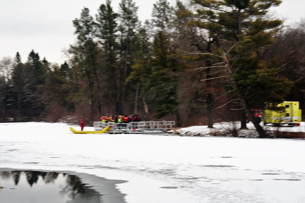 Fort McCoy firefighters practice surface ice rescue training at post's Swamp Pond