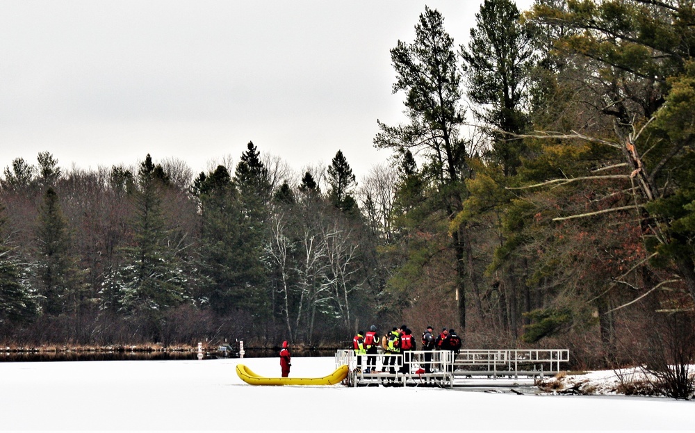 Fort McCoy firefighters practice surface ice rescue training at post's Swamp Pond