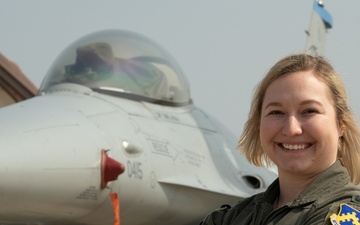 8th Fighter Wing female pilot poses in front of her plane