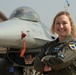 8th Fighter Wing female pilot poses in front of her plane