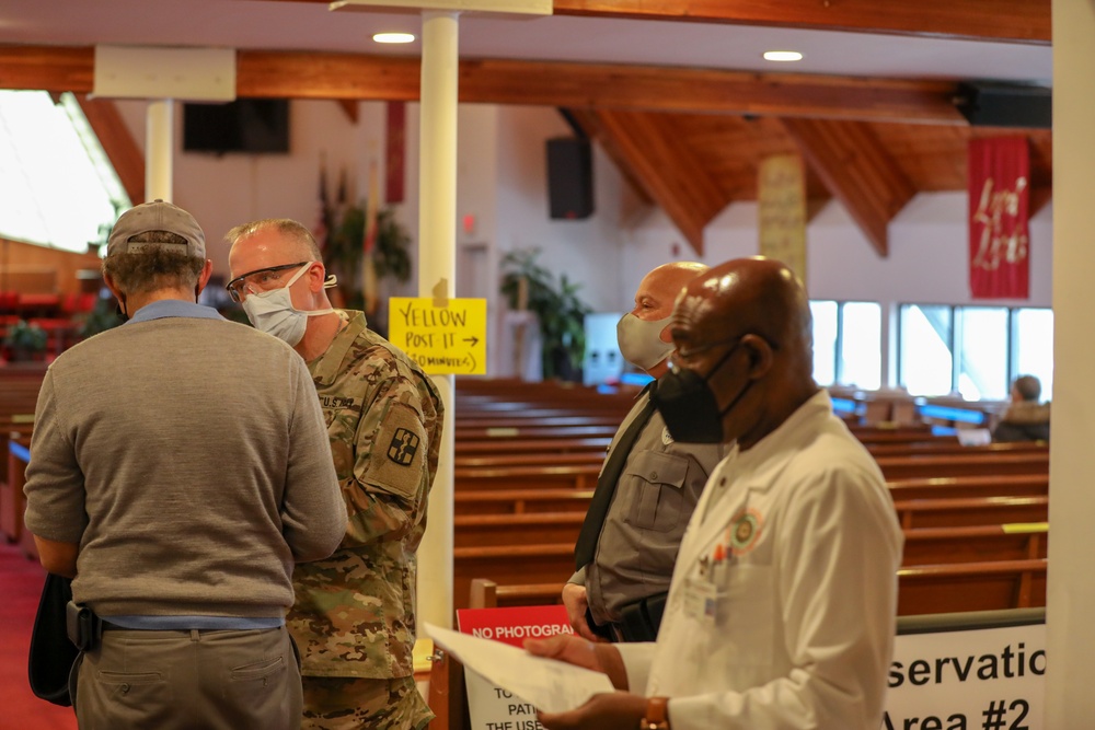 Service members help community members in Orange, NJ