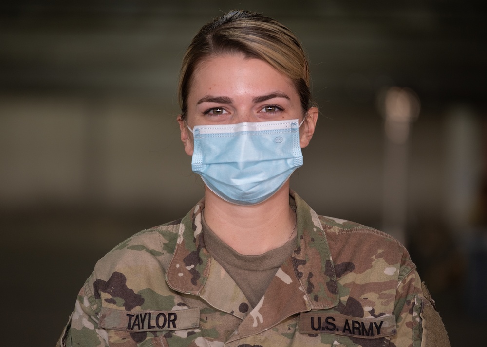 U.S. Army medic stands in recognition of Women's History