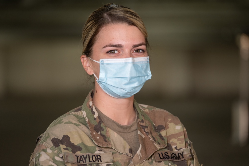 U.S. Army medic stands in recognition of Women's History