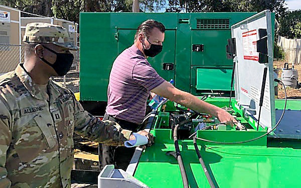 Capt. Robert Alleyne, LSB, Detachment 11, inspects a backup fuel tank in National City, California