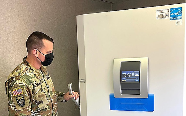 Capt. Mike Miller, LSB, Detachment 11, verifies the operational status of the ultra-low temperature freezer