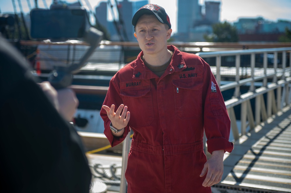 Damage Controlman 1st Class Julia Murray, assigned to USS Constitution, conducts a live tour about the Navy’s first enlisted female Loretta Walsh