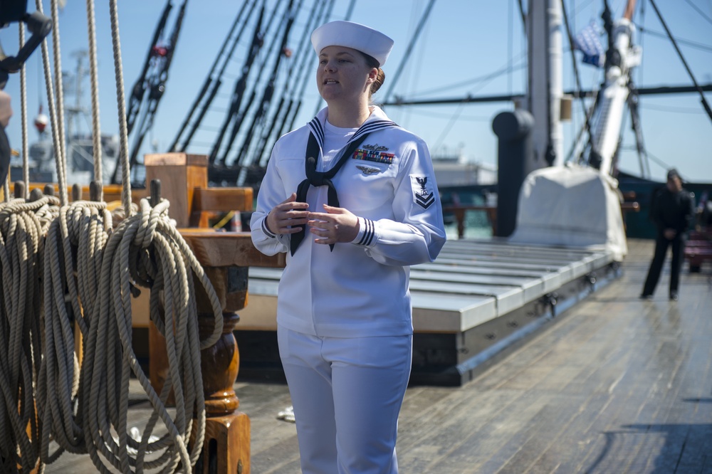 Culinary Specialist 2nd Class Rose Fennell, assigned to USS Constitution, conducts a live tour about the Navy’s first enlisted female Loretta Walsh