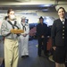 Sailors assigned to USS Constitution present a new gun name for the Navy’s first enlisted female Loretta Walsh during a Facebook live tour