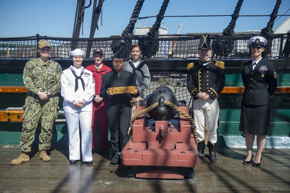 Sailors assigned to USS Constitution pose for a photo on the spar deck