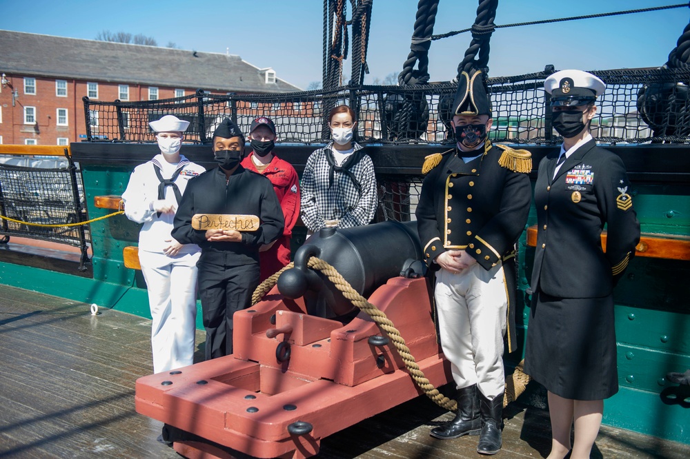 Sailors assigned to USS Constitution pose for a photo