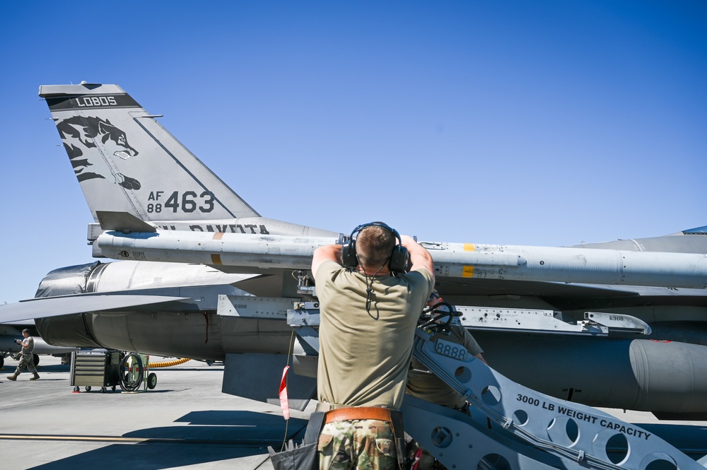 South Dakota Air Guardsmen load munitions on F-16s