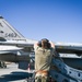 South Dakota Air Guardsmen load munitions on F-16s