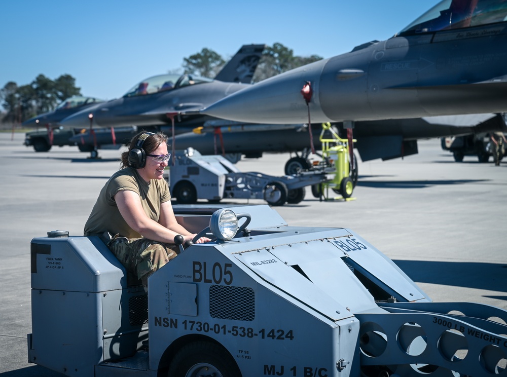 South Dakota Air Guardsmen load munitions on F-16s
